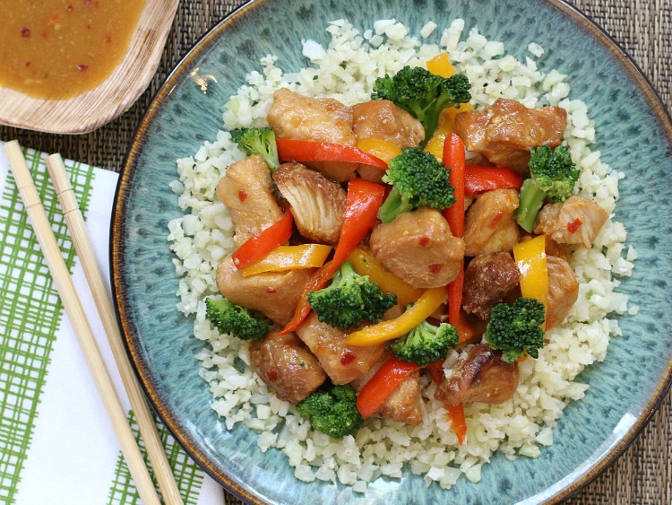 Slow Cooker Sweet & Spicy Chicken! Simply toss this tasty freezer meal right into your slow cooker and enjoy a super-easy home-cooked meal!